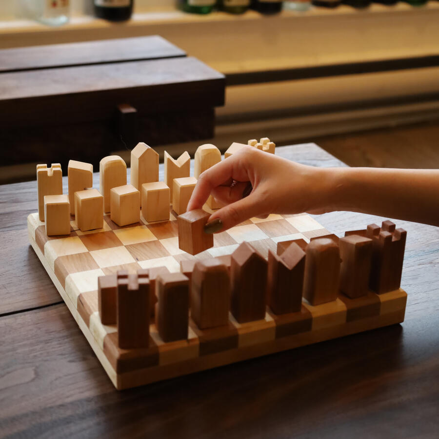 "DUEL" Premium Handmade Chess Set, in Cherry and Maple, is a minimal style set designed by Estudio GOO.