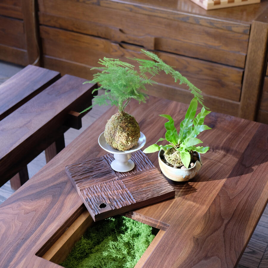 Temple's "COURTYARD" features a removable hand carved centrepiece, with a hidden compartment below. By Estudio GOO.