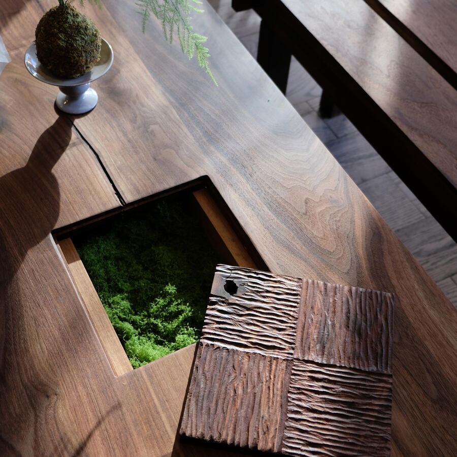 Temple's "COURTYARD" features a removable hand carved centrepiece, with a hidden compartment below. By Estudio GOO.